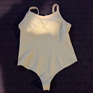 Lululemon creamy mint rubbed yoga bodysuit size 12